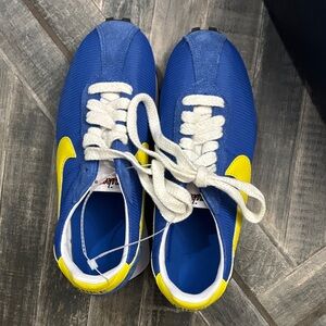 Blue and Yellow Nike cleats